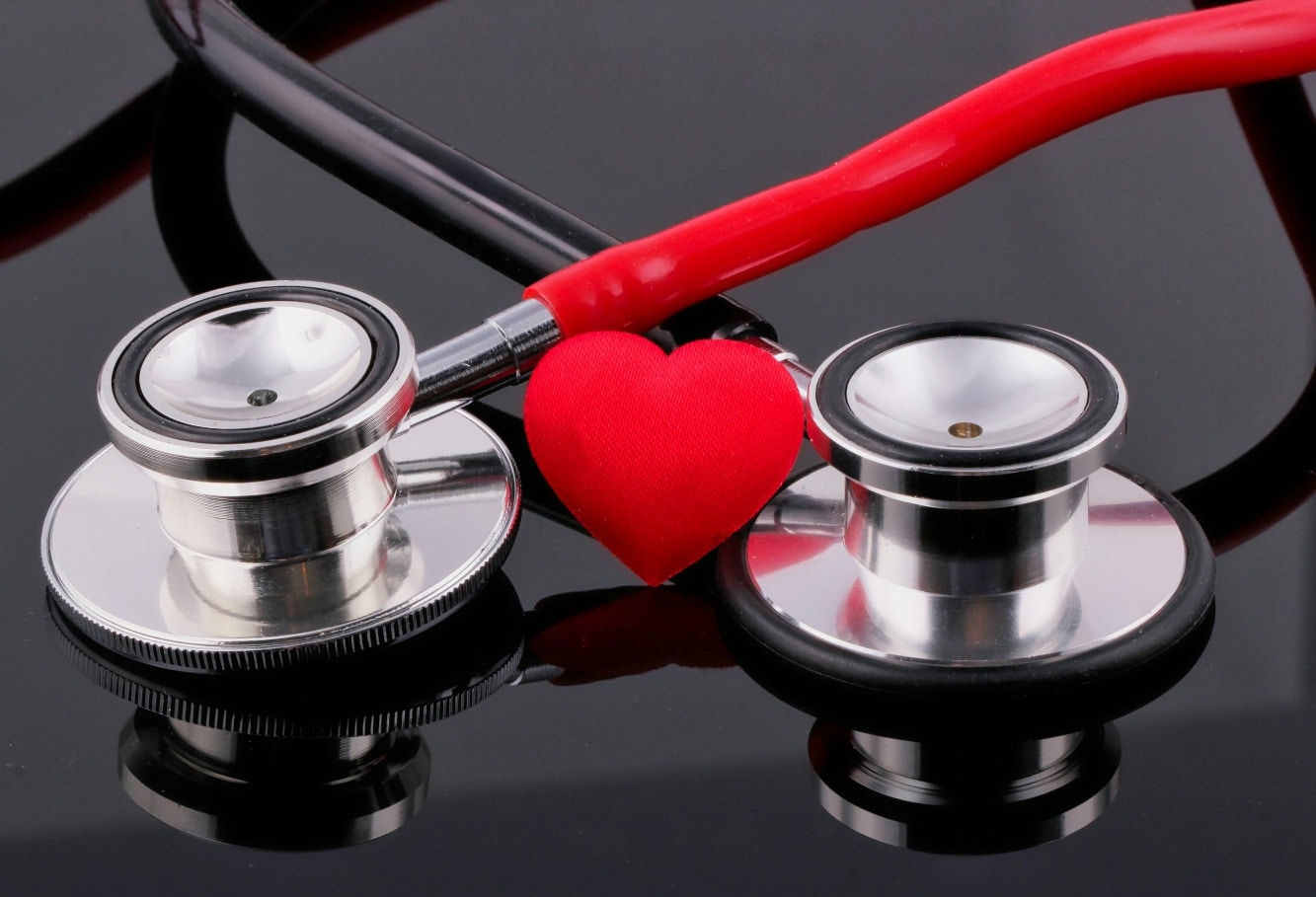 Stethoscope with red heart symbol representing cardiovascular health and blood pressure awareness