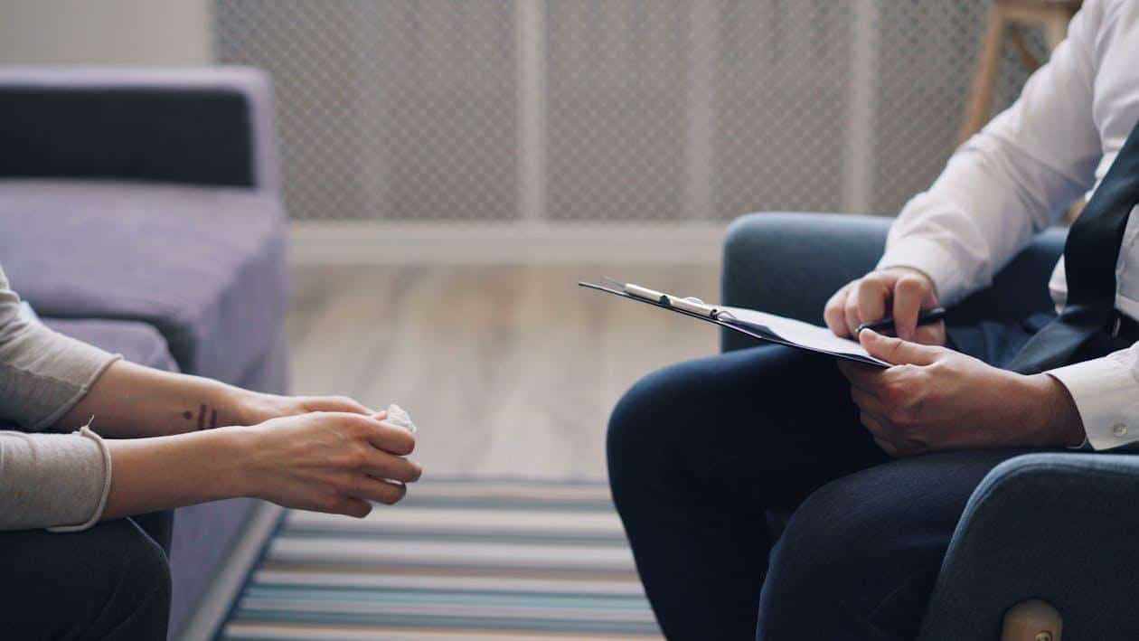 a person in therapy getting a diagnosis.
