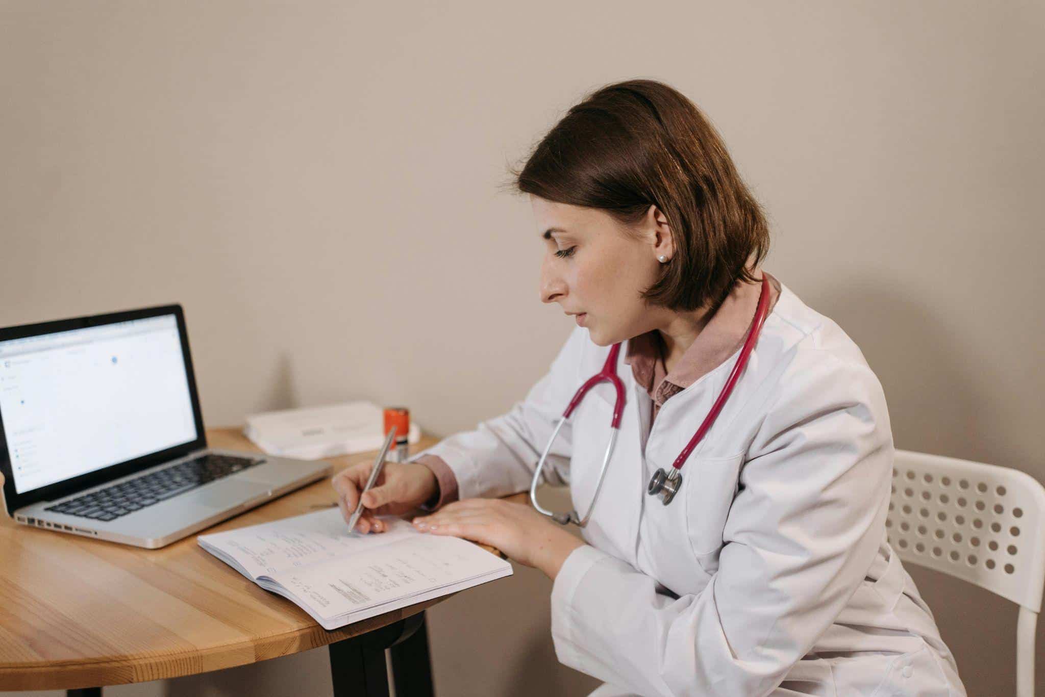 a doctor making notes