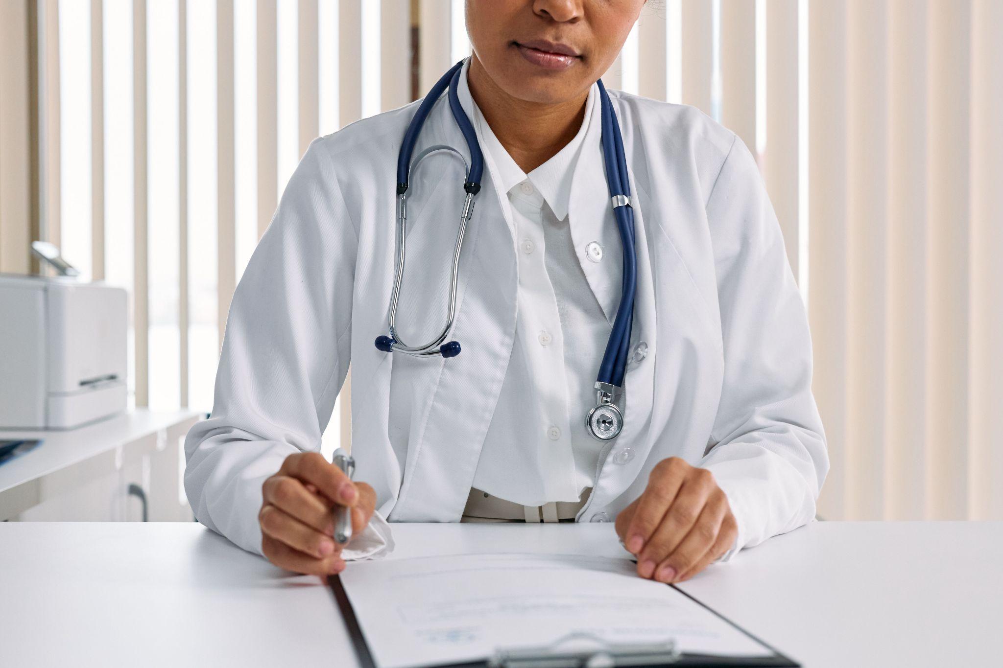 a doctor reviewing a medical document