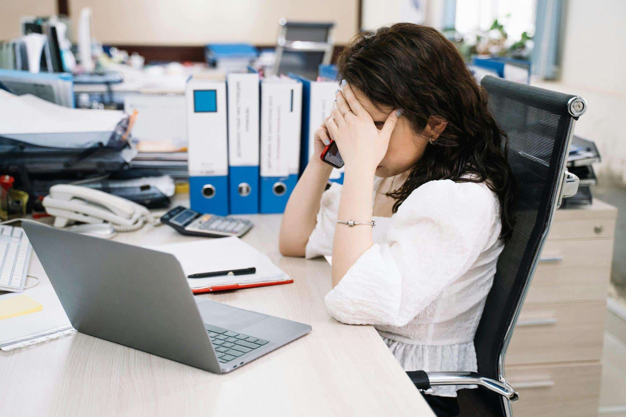 a stressed person sitting in an office