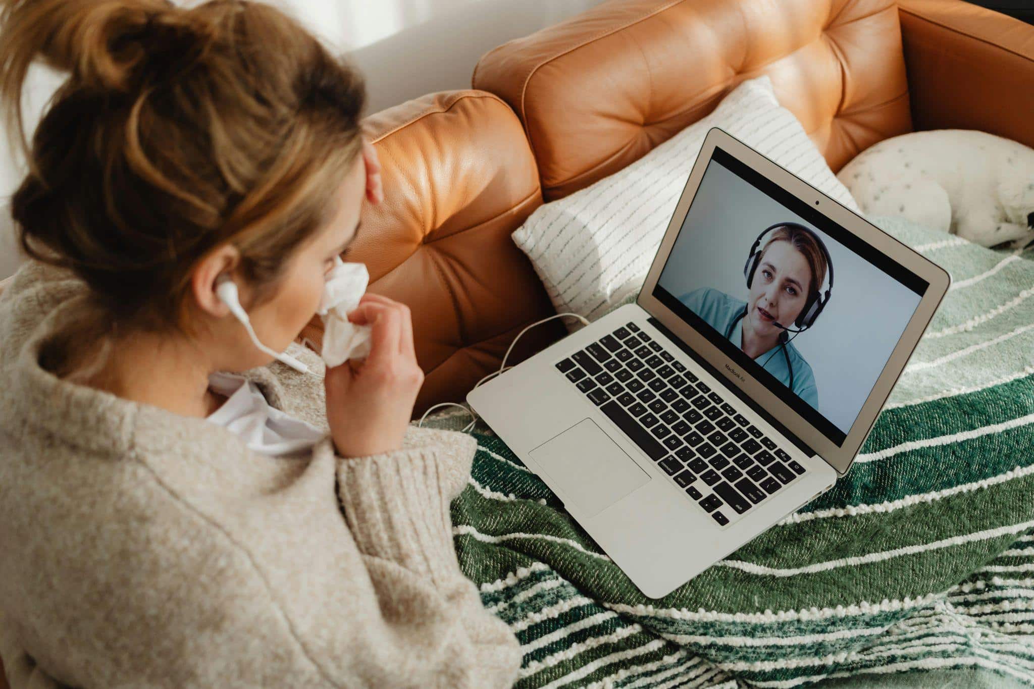 a sick person consulting a healthcare provider online