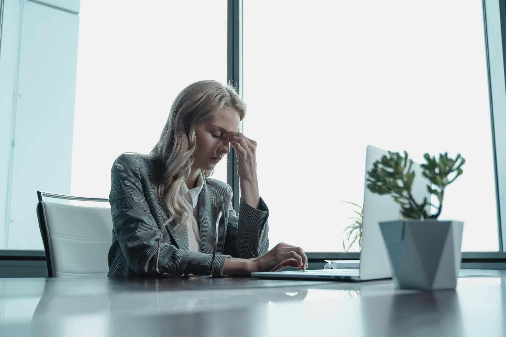 a woman feeling stressed at work